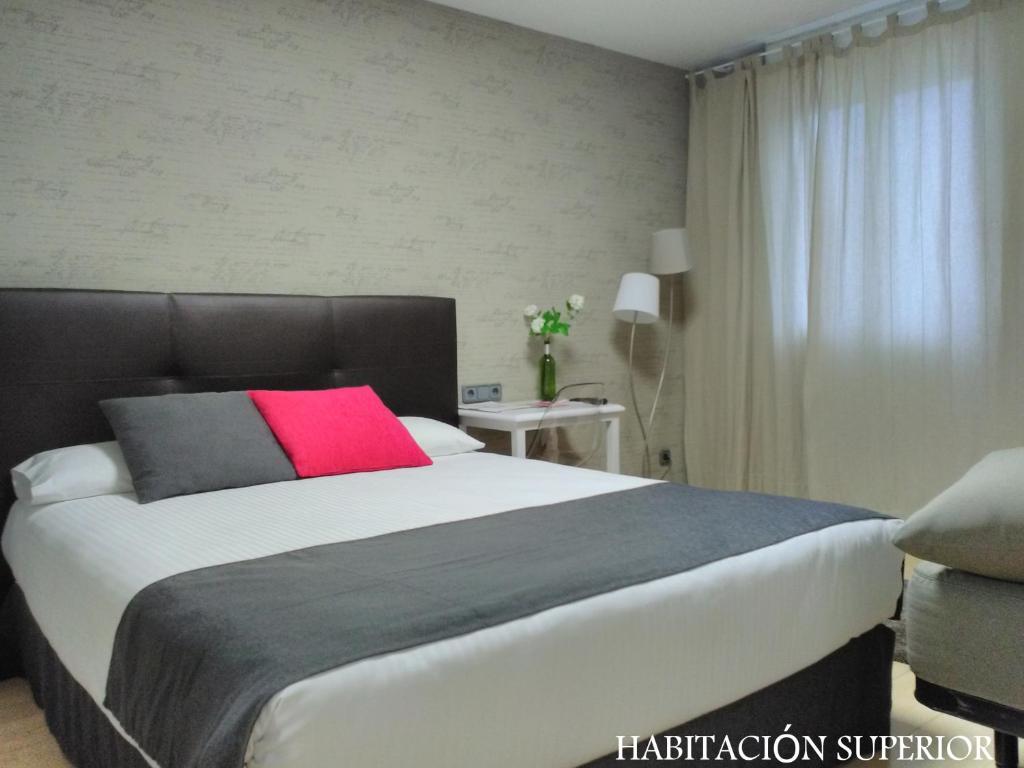 Postel nebo postele na pokoji v ubytování Hotel Junquera