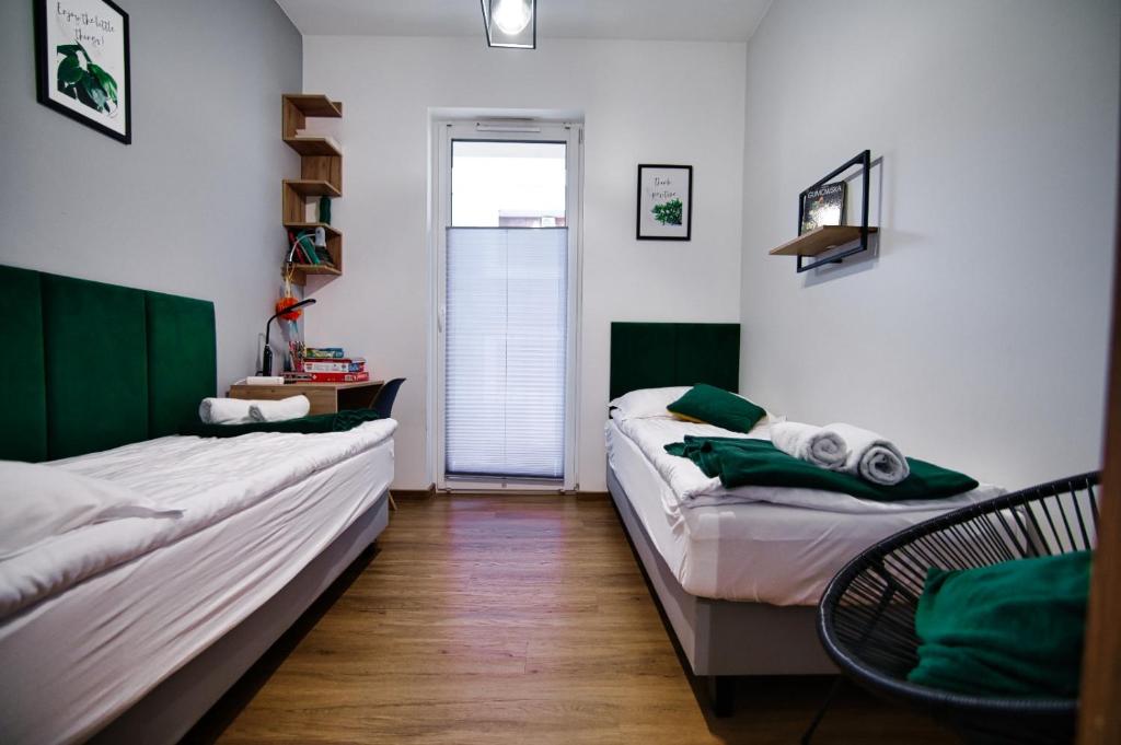 Posteľ alebo postele v izbe v ubytovaní Apartament No 34 Green - Holiday Home Zator