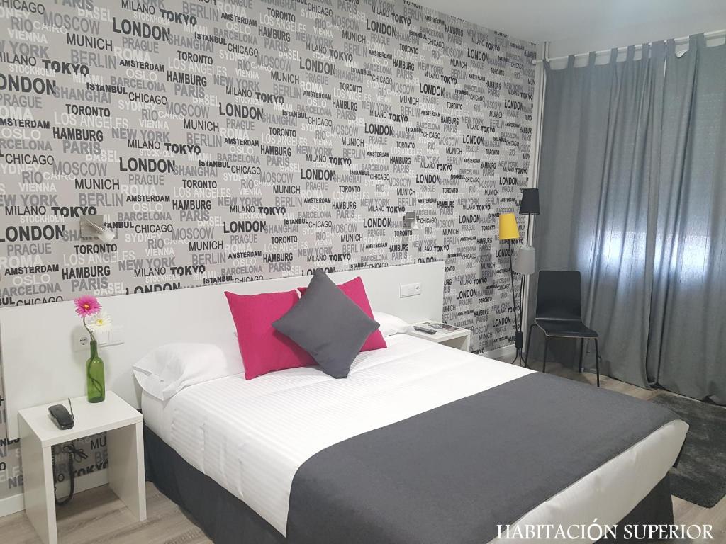 Postel nebo postele na pokoji v ubytování Hotel Junquera