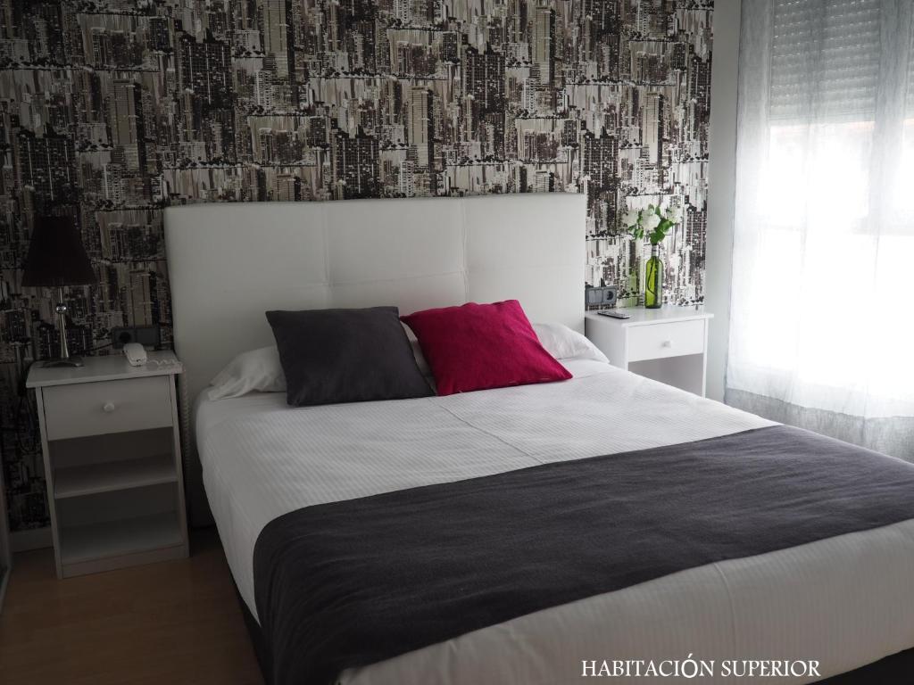 Postel nebo postele na pokoji v ubytování Hotel Junquera