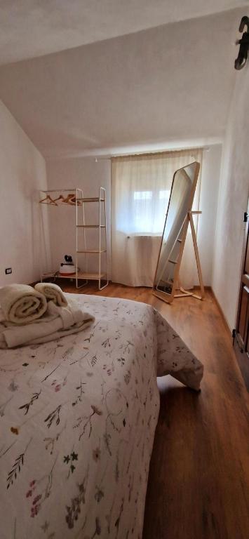 Postel nebo postele na pokoji v ubytování Il rifugio di Claudia
