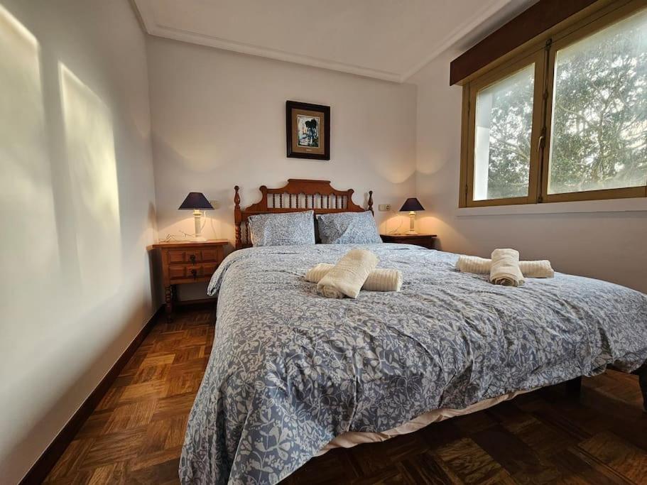 En eller flere senge i et værelse på 303A Casa Elisa Cudillero by R2R Consulting