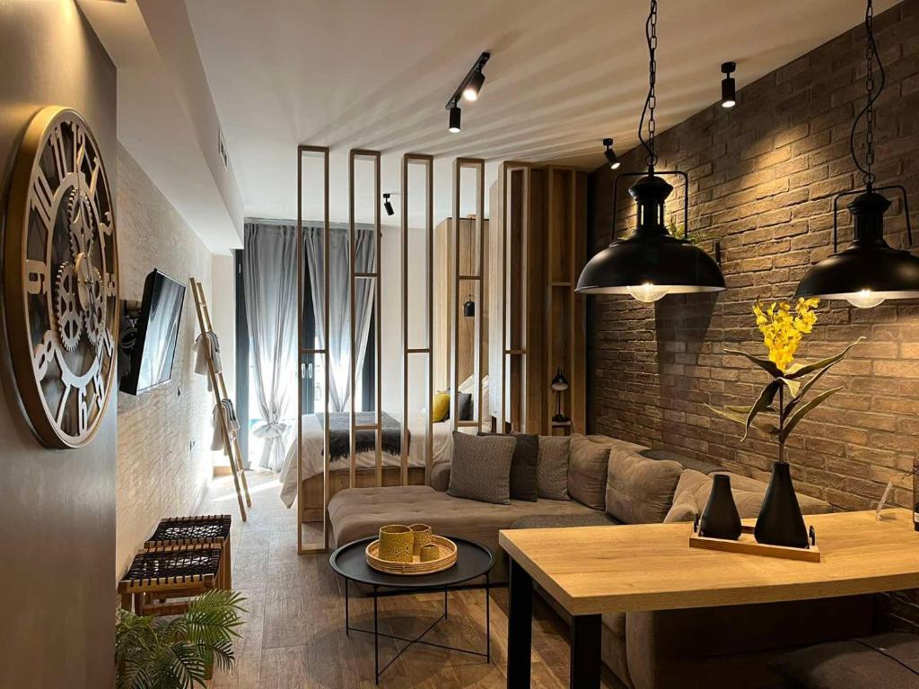 a living room with a couch and a table at G&A casa centrale in Ioannina