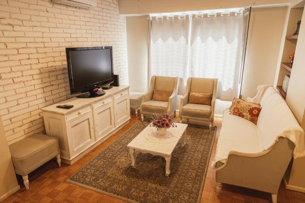 TV a/nebo společenská místnost v ubytování Morada da Praça