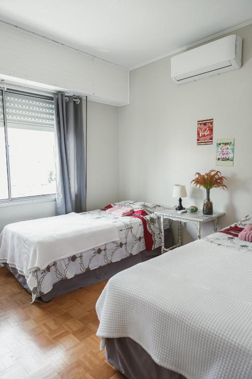 Postel nebo postele na pokoji v ubytování Morada da Praça