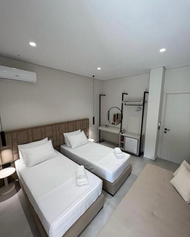Postel nebo postele na pokoji v ubytování Astoria Rooms