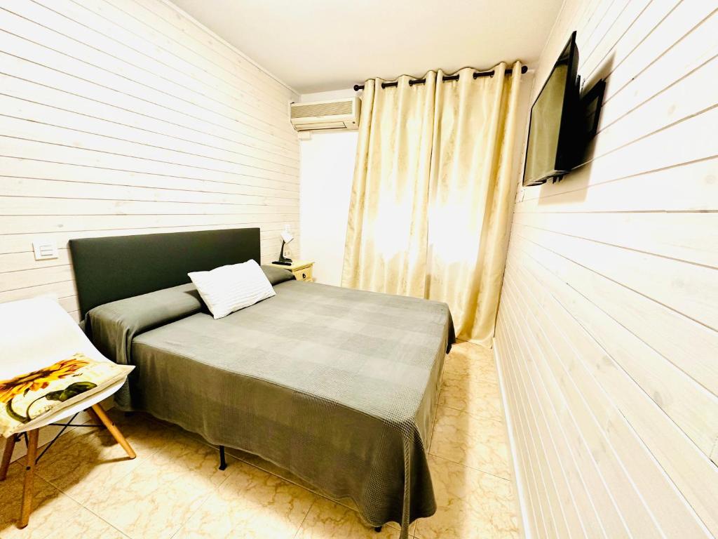 Postel nebo postele na pokoji v ubytování Hostal La Taberna