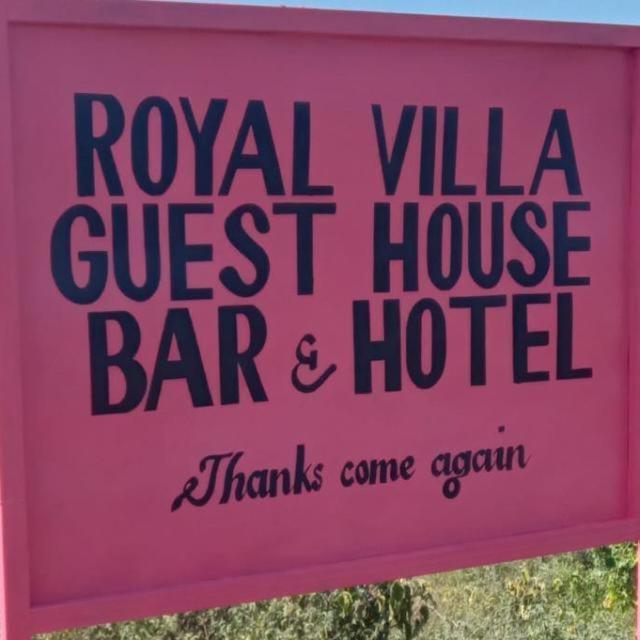 a sign for a local villa guest house bar and hotel at Royal Villa Guest House in Baragoi