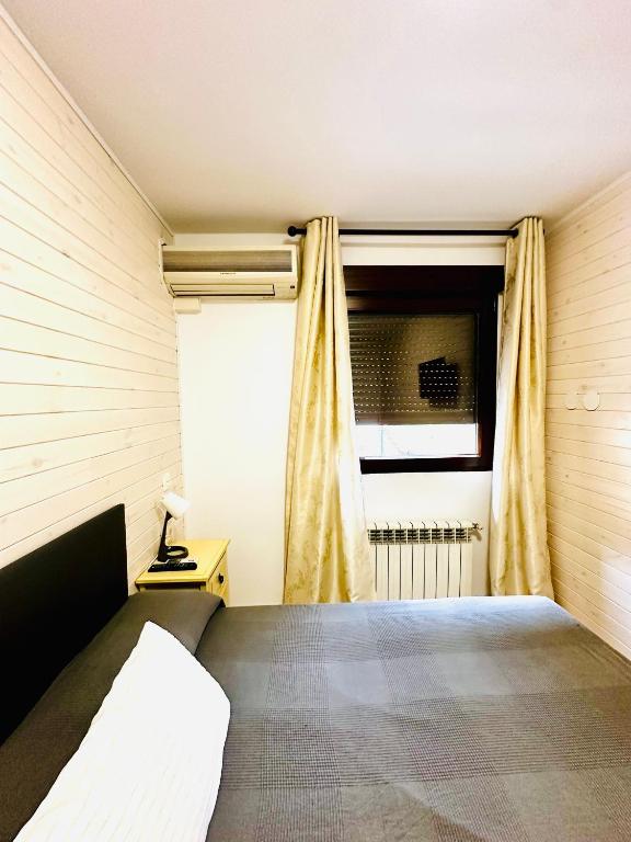 TV a/nebo společenská místnost v ubytování Hostal La Taberna