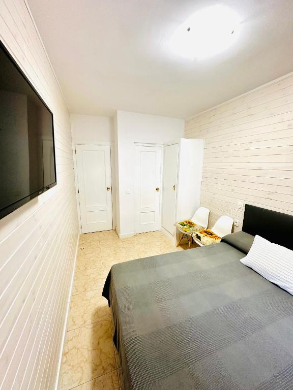 Postel nebo postele na pokoji v ubytování Hostal La Taberna