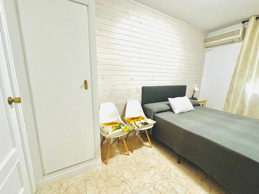 Postel nebo postele na pokoji v ubytování Hostal La Taberna