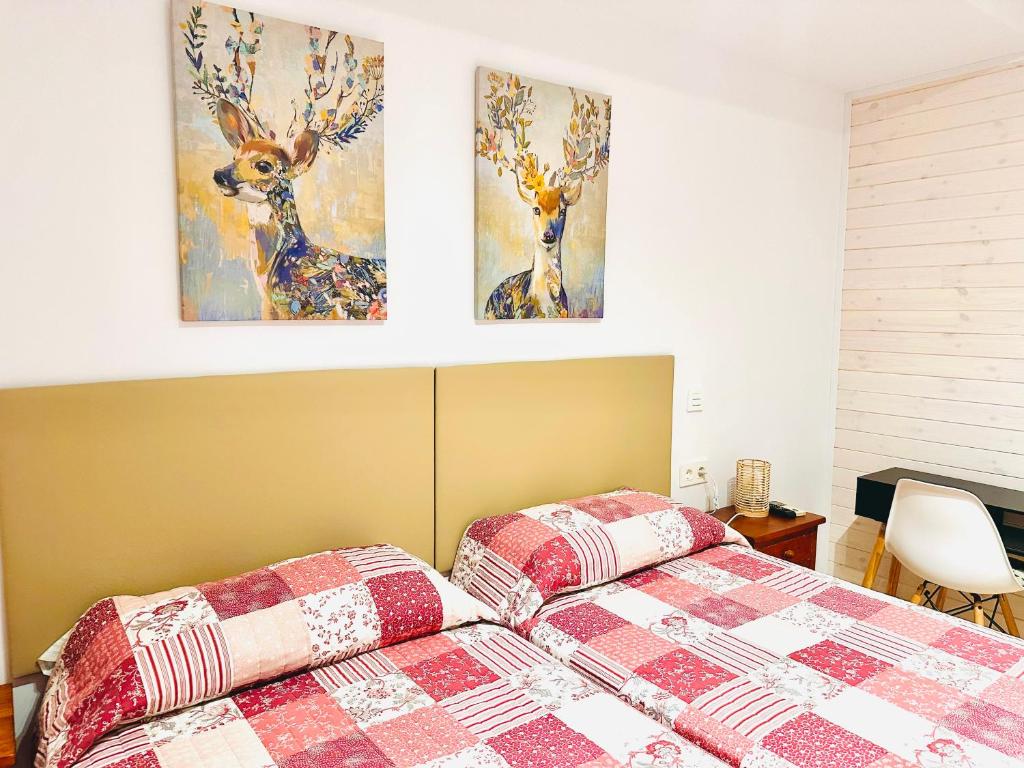Postel nebo postele na pokoji v ubytování Hostal La Taberna