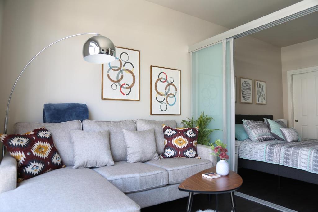 a living room with a couch and a bed at Queen Anne Retreat - 1 Blk from CPA - Free Parking in Seattle