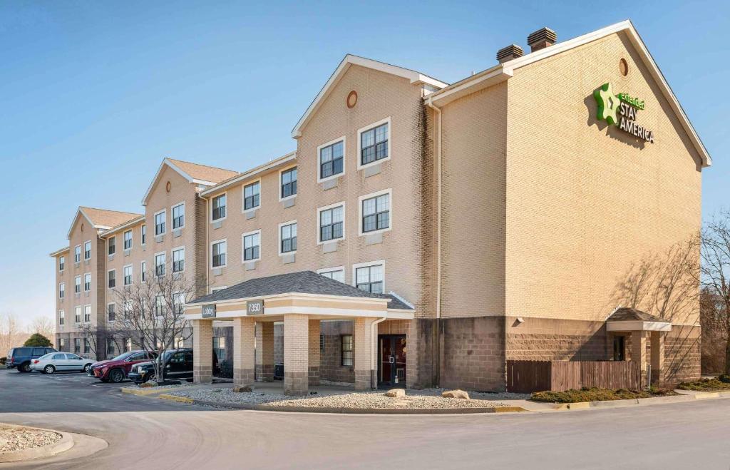 a building with a lion sign on the side of it at Extended Stay America Suites - Cincinnati - Florence - Turfway Rd in Florence