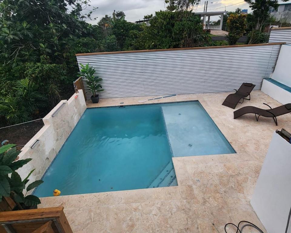 a small swimming pool in the middle of a backyard at Casita Kiri in San Sebastian