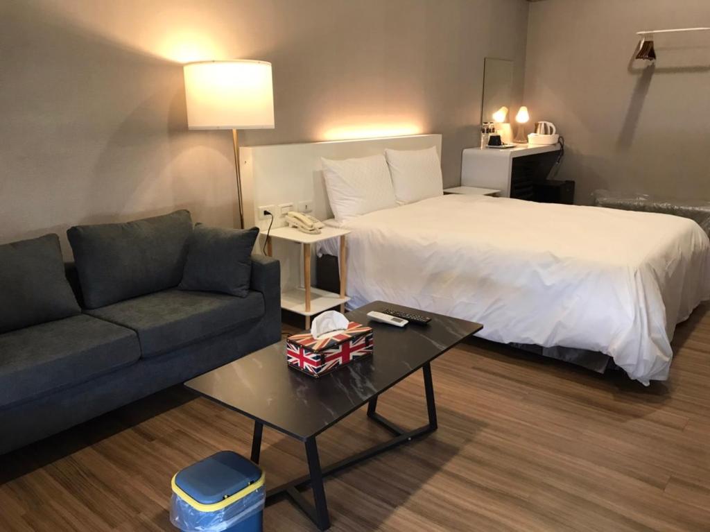Postel nebo postele na pokoji v ubytování 藝築文旅-昆明館Artinn Kunming