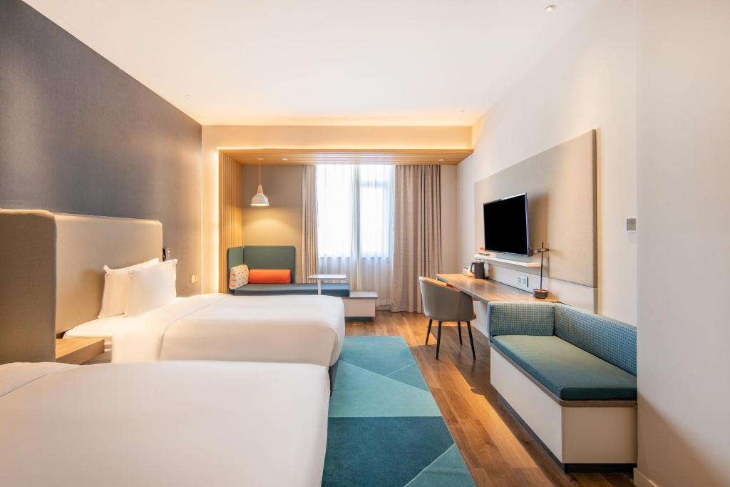 Postel nebo postele na pokoji v ubytování Holiday Inn Express Shanghai Jiading New City by IHG