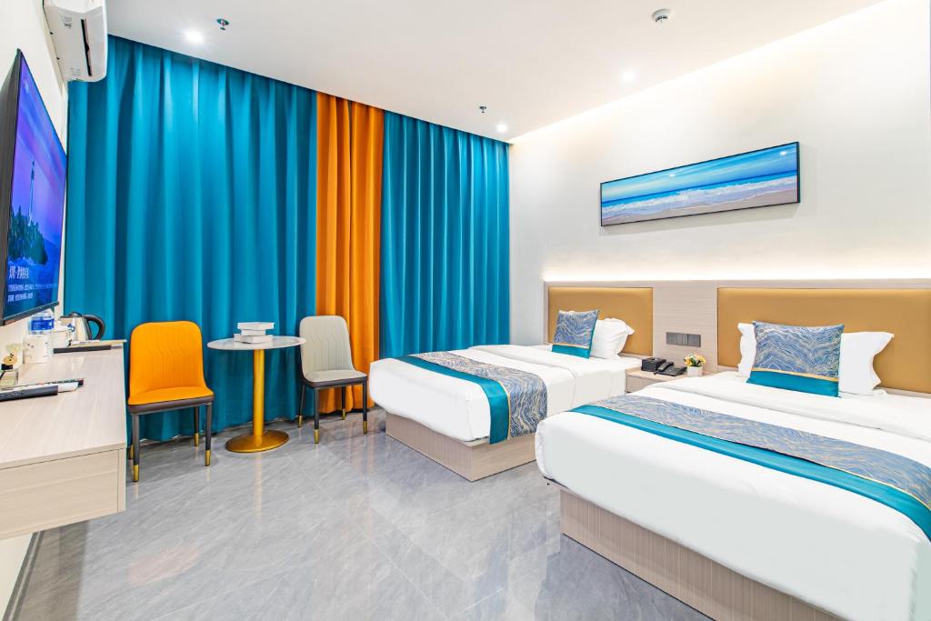 Postel nebo postele na pokoji v ubytování Zhuhai Golden Lake Bay Hotel