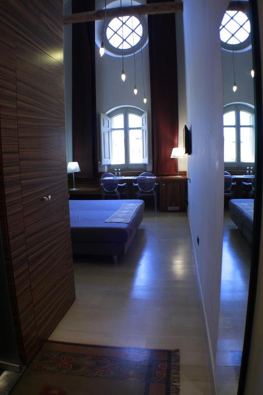 A bed or beds in a room at Hotel Sant Roc
