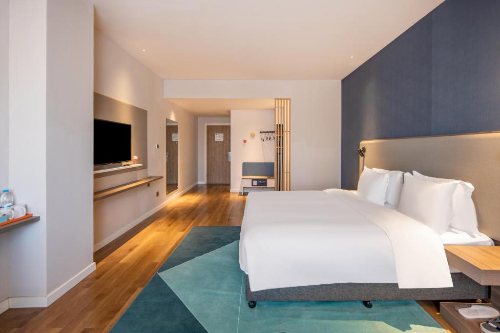 Postel nebo postele na pokoji v ubytování Holiday Inn Express Shanghai Jiading New City by IHG