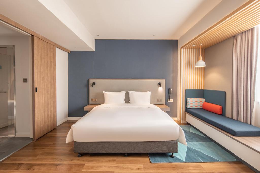 Postel nebo postele na pokoji v ubytování Holiday Inn Express Shanghai Jiading New City by IHG