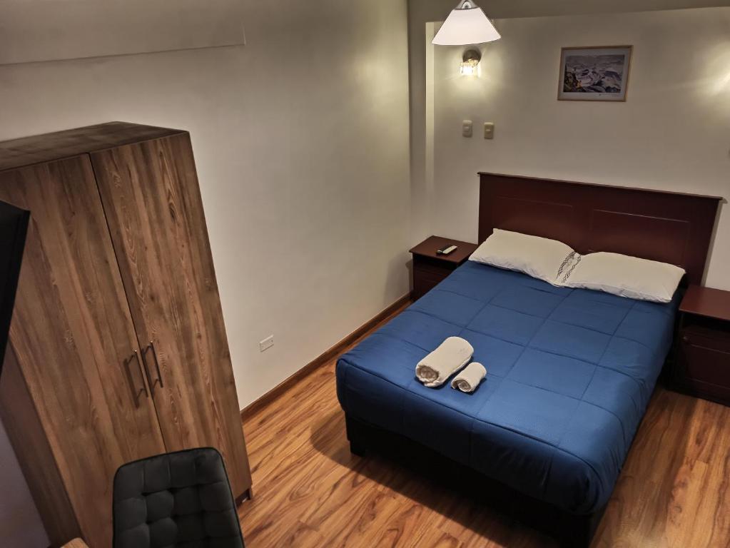 Postel nebo postele na pokoji v ubytování El Ave Azul Boutique Hotel Cusco