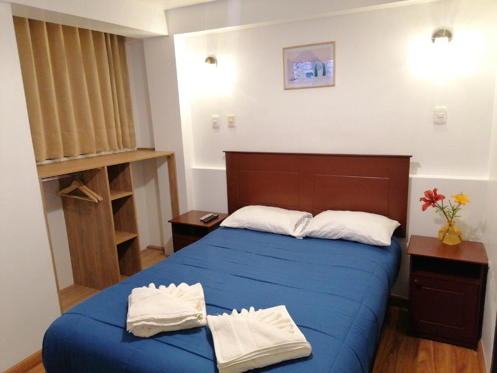 Postel nebo postele na pokoji v ubytování El Ave Azul Boutique Hotel Cusco