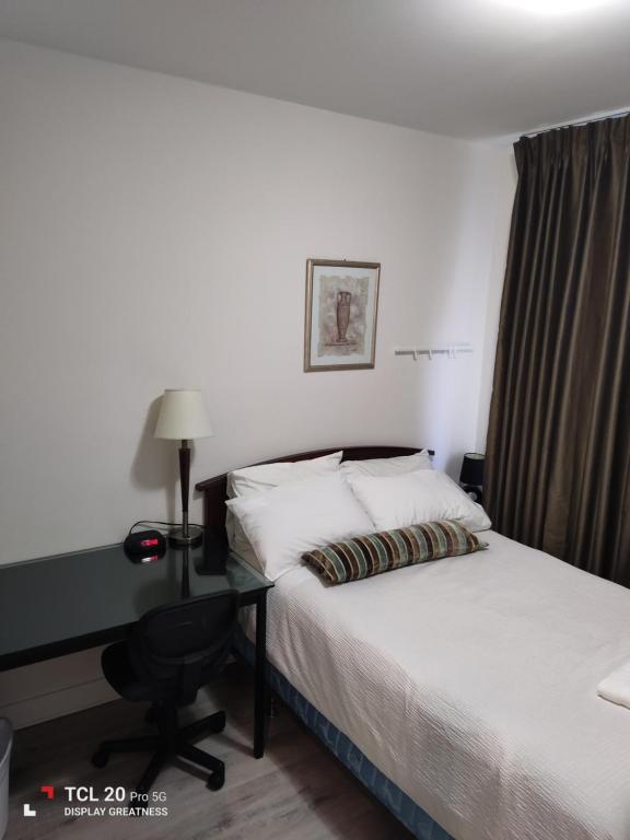 Postel nebo postele na pokoji v ubytování Sweet House B&B
