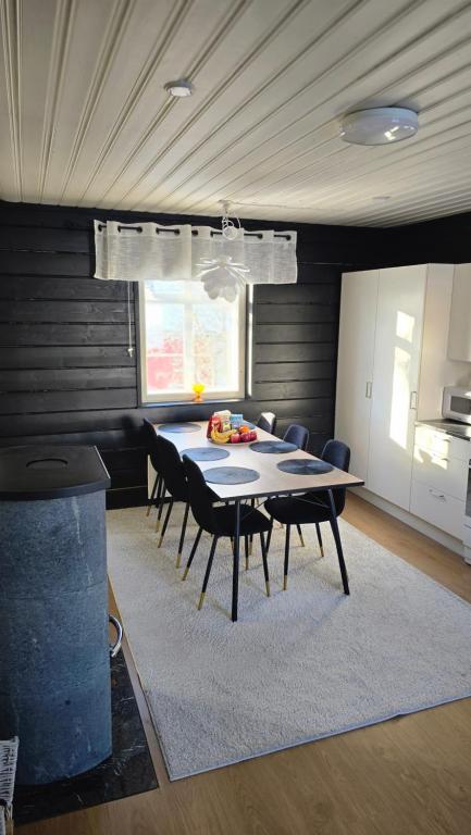 a dining room with a table and chairs at Pohjankatu (Vanha Rauma) in Rauma