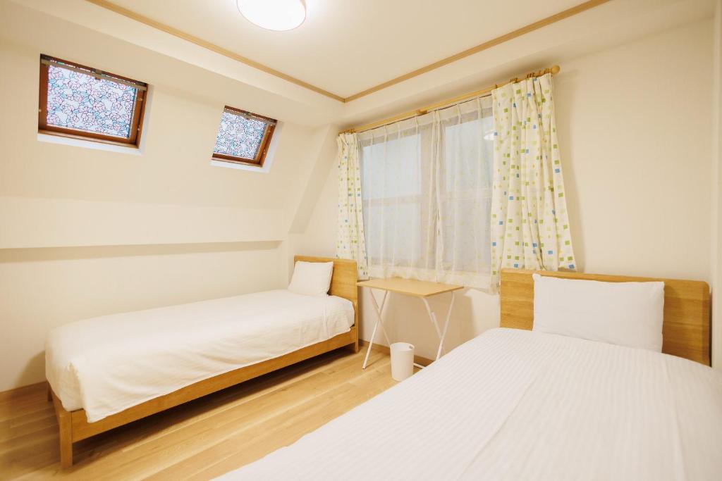 Hotaku HOTEL Akihabaraにあるベッド