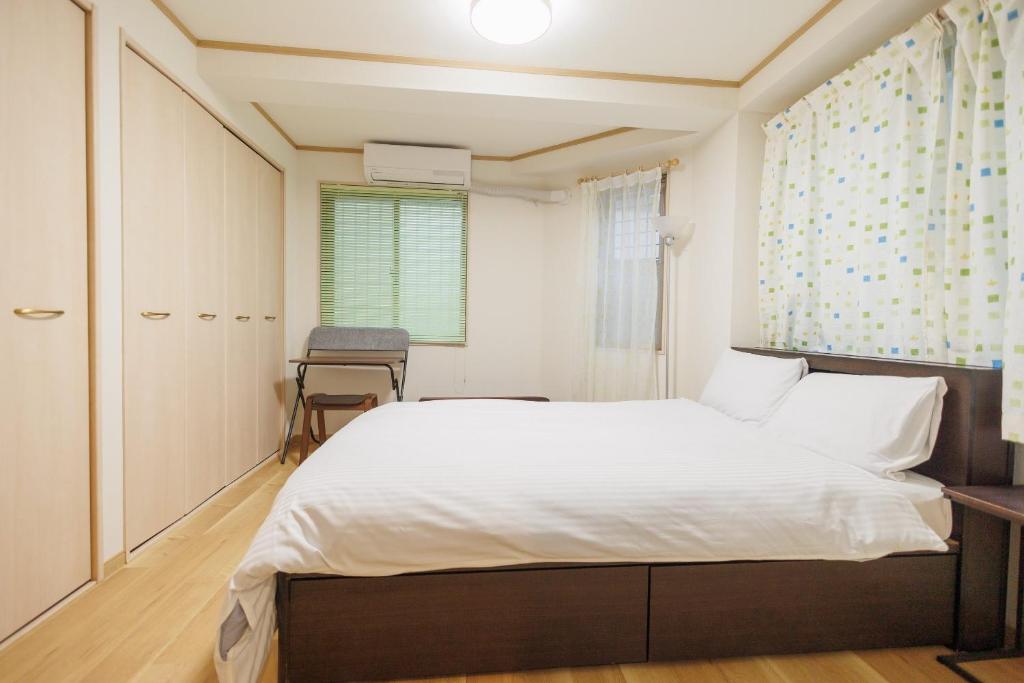 Hotaku HOTEL Akihabaraにあるベッド