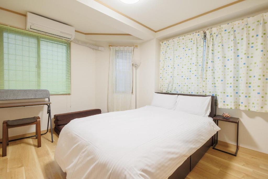 Hotaku HOTEL Akihabaraにあるベッド