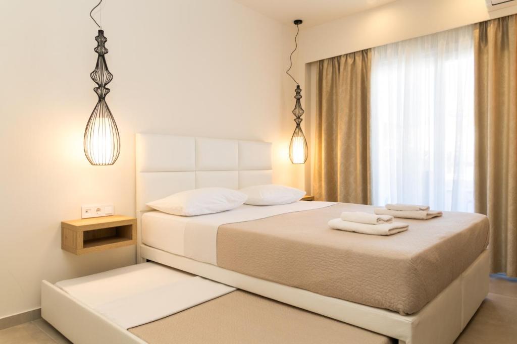 Postel nebo postele na pokoji v ubytování Mystery Suites and Apartments
