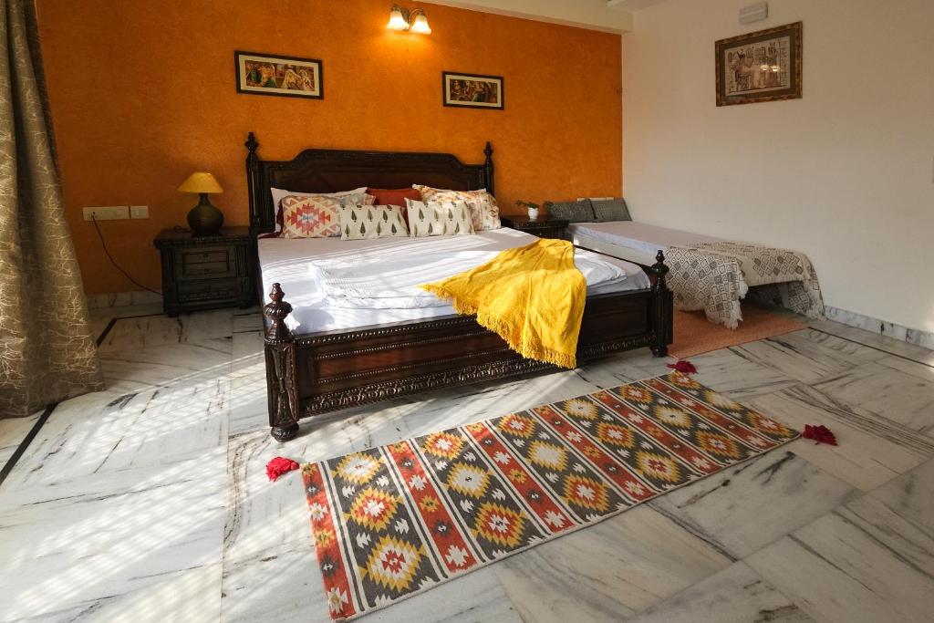 a bedroom with two beds and a rug at Prakash Kutir B&B in New Delhi