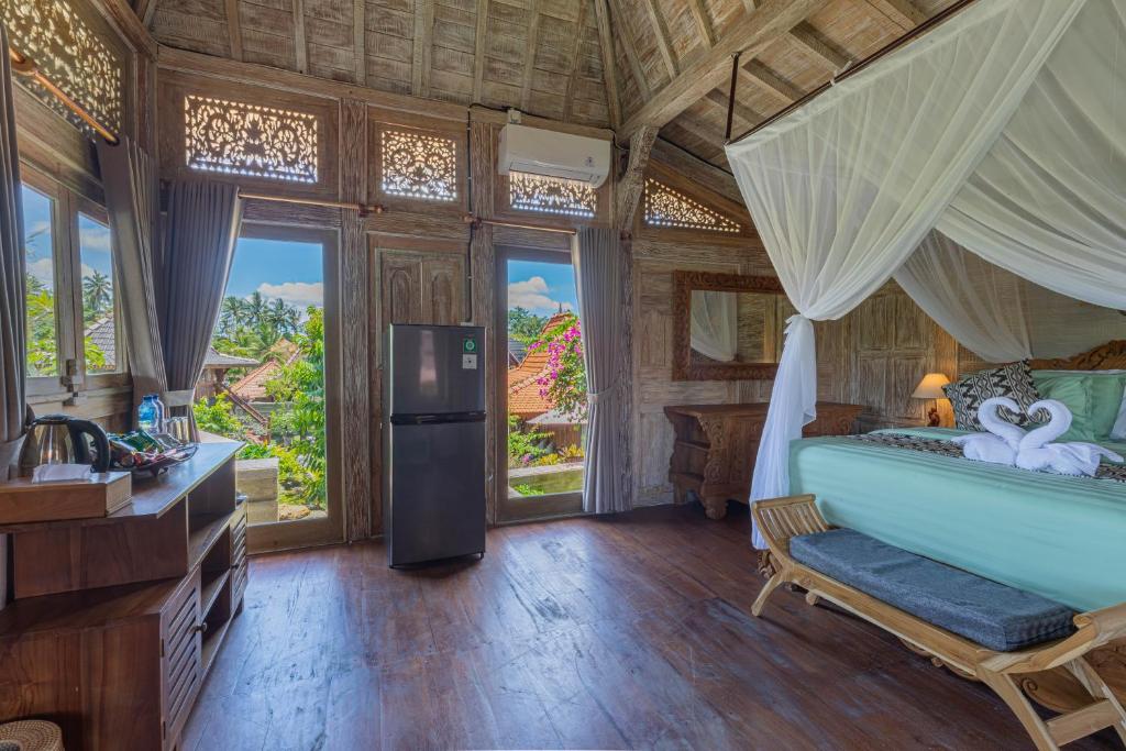 Postel nebo postele na pokoji v ubytování Billys Ayodya Villa