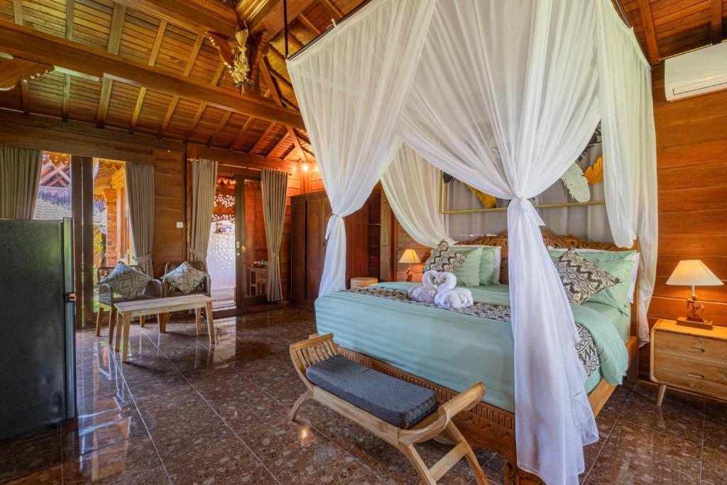 Postel nebo postele na pokoji v ubytování Billys Ayodya Villa