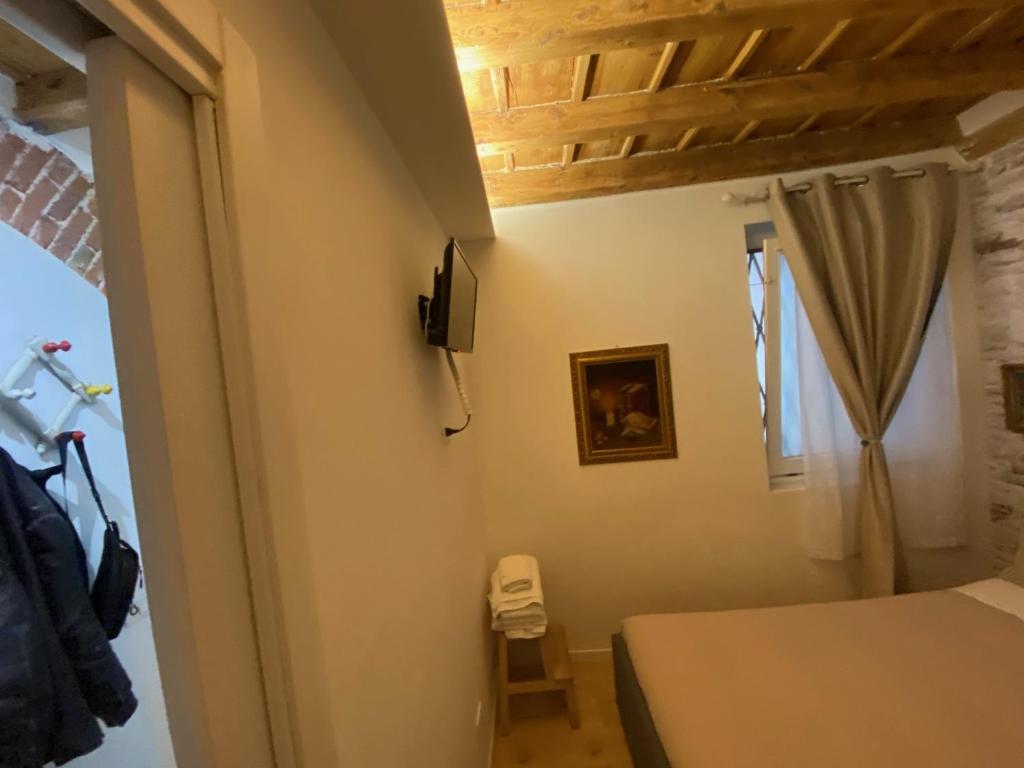A bed or beds in a room at 30 San Gottardo House