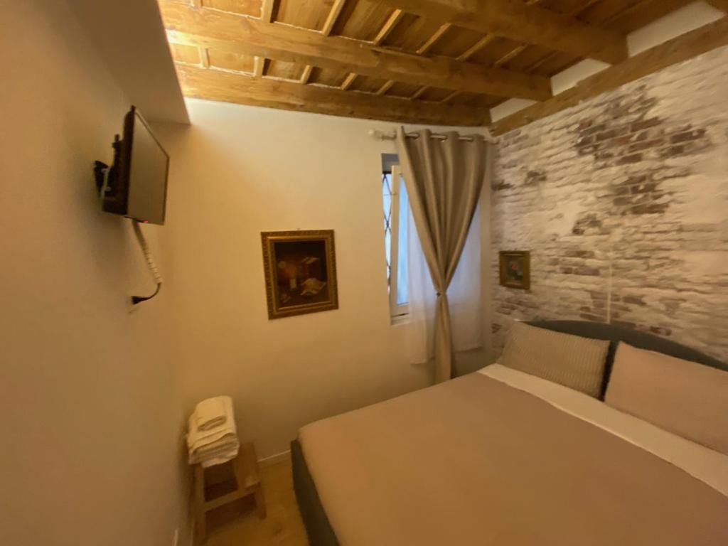 A bed or beds in a room at 30 San Gottardo House