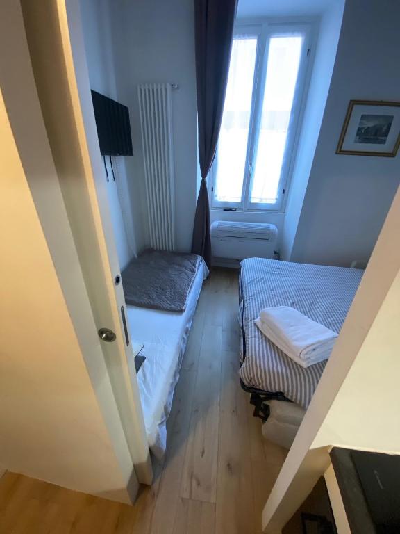 A bed or beds in a room at 30 San Gottardo House