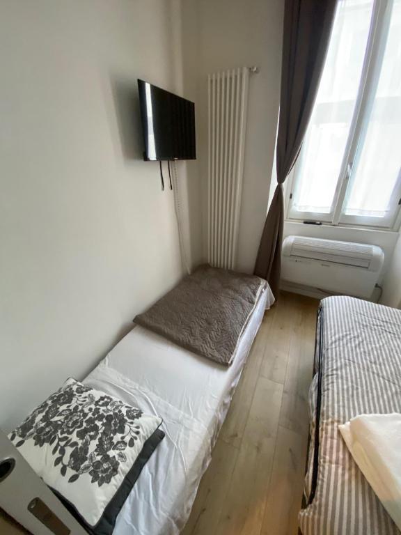 A bed or beds in a room at 30 San Gottardo House