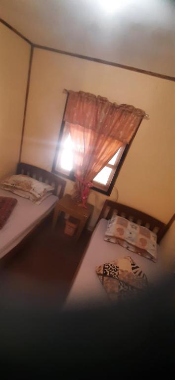 Postel nebo postele na pokoji v ubytování Hiker's Homestay