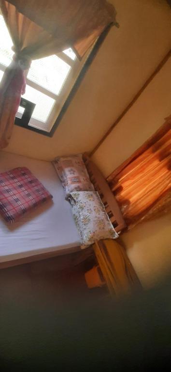 Postel nebo postele na pokoji v ubytování Hiker's Homestay