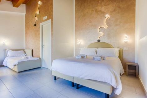 Postel nebo postele na pokoji v ubytování Albergo Diffuso Amatrice