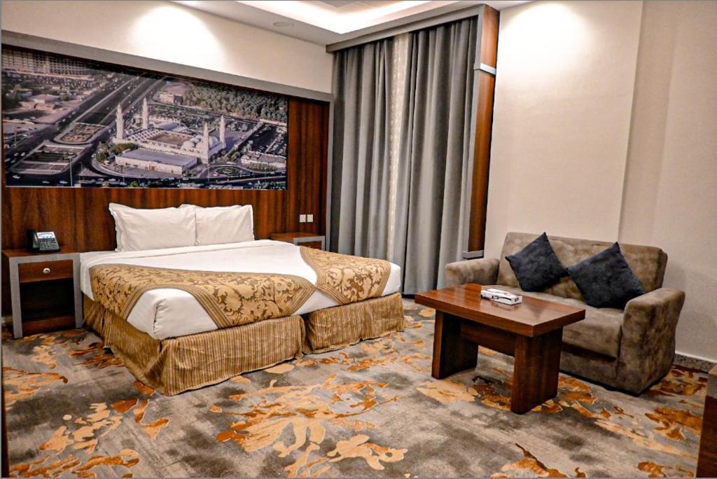 En eller flere senge i et værelse på فندق بلانتي 2