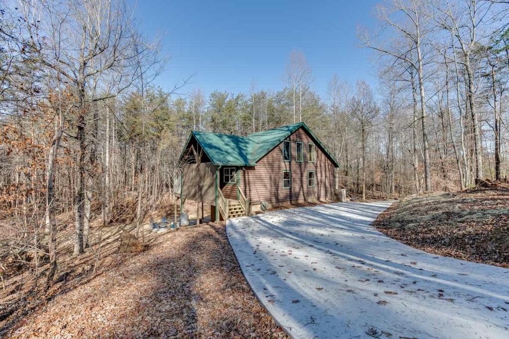 a small house in the middle of a road at Fantastic Family Cabin w Firepit in Cleveland