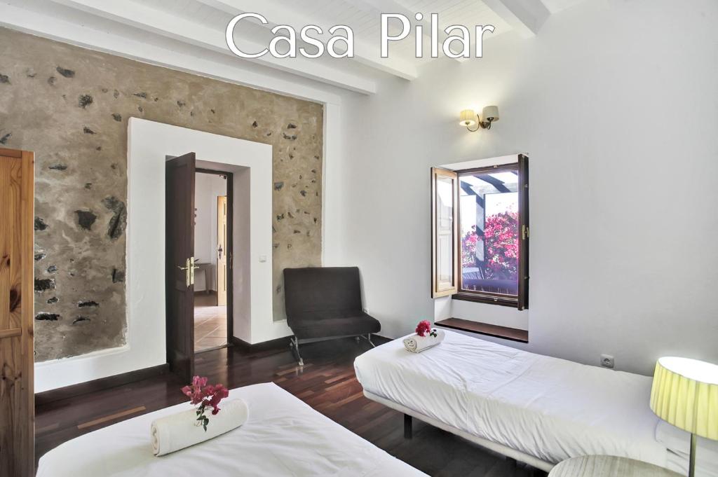 Postel nebo postele na pokoji v ubytování Casa Pilar, Aurora y Tarabilla en Finca Ecológica