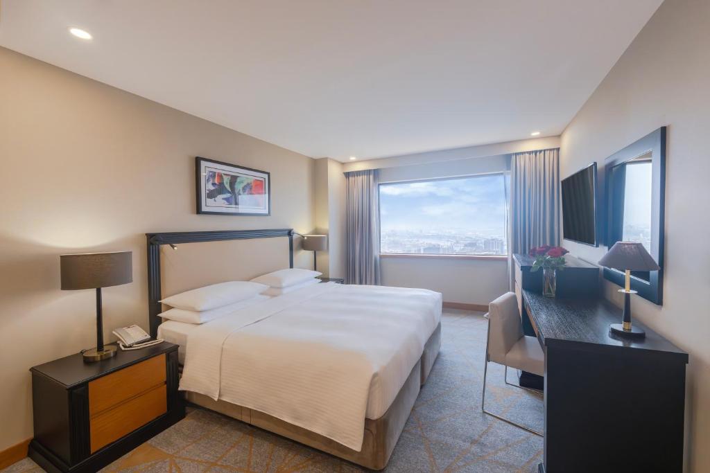 Postel nebo postele na pokoji v ubytování Hyatt Regency Galleria Residence Dubai