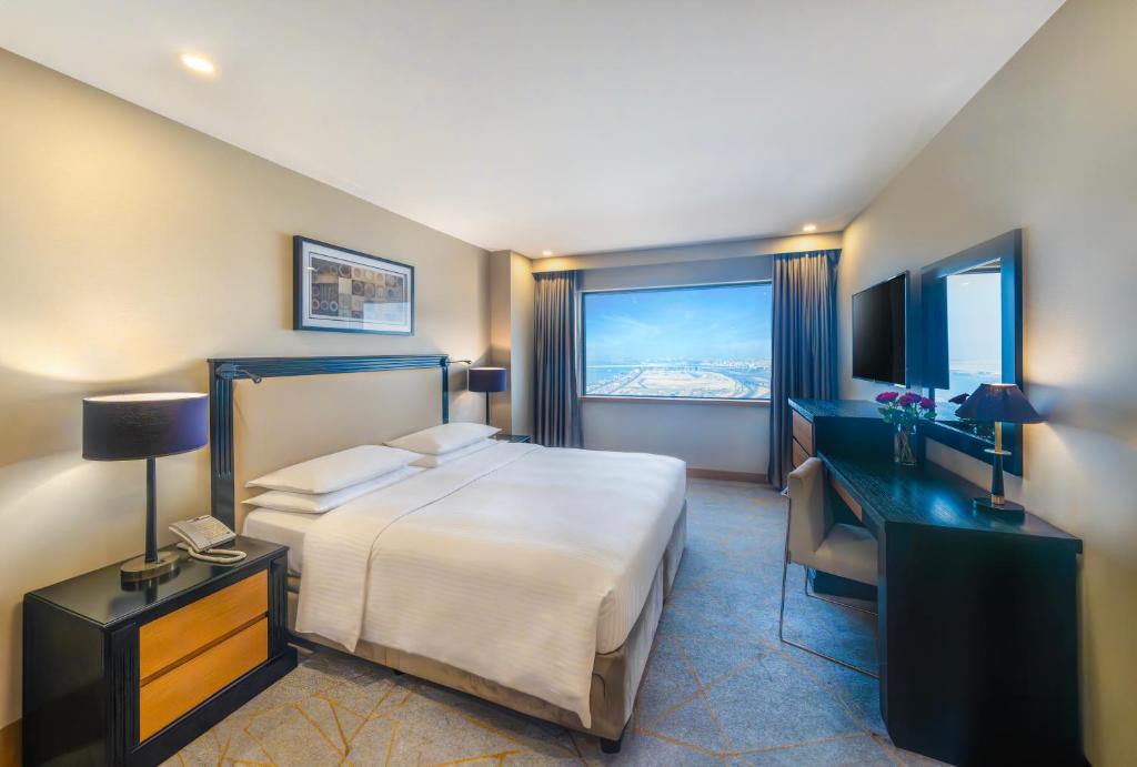Postel nebo postele na pokoji v ubytování Hyatt Regency Galleria Residence Dubai