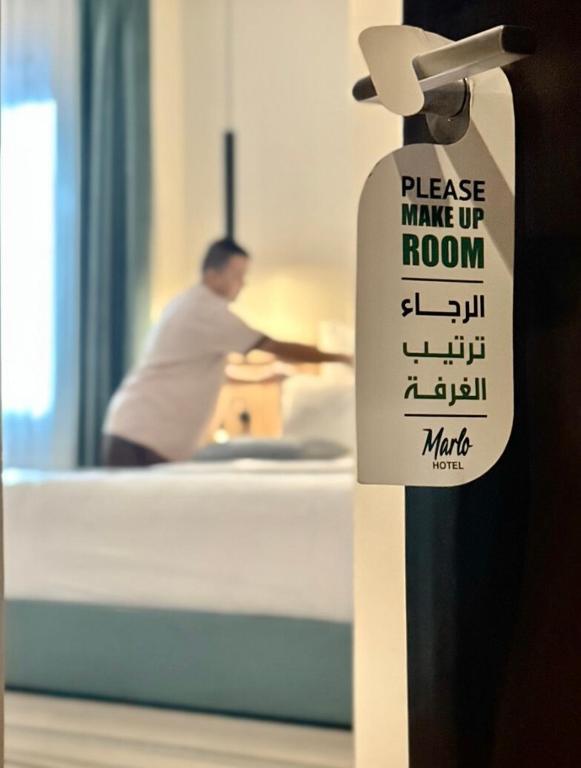 Postel nebo postele na pokoji v ubytování Marlo Hotel - فندق مارلو