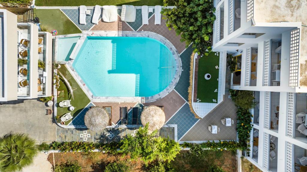 an overhead view of a swimming pool in an apartment complex at Stella Maria in Malia